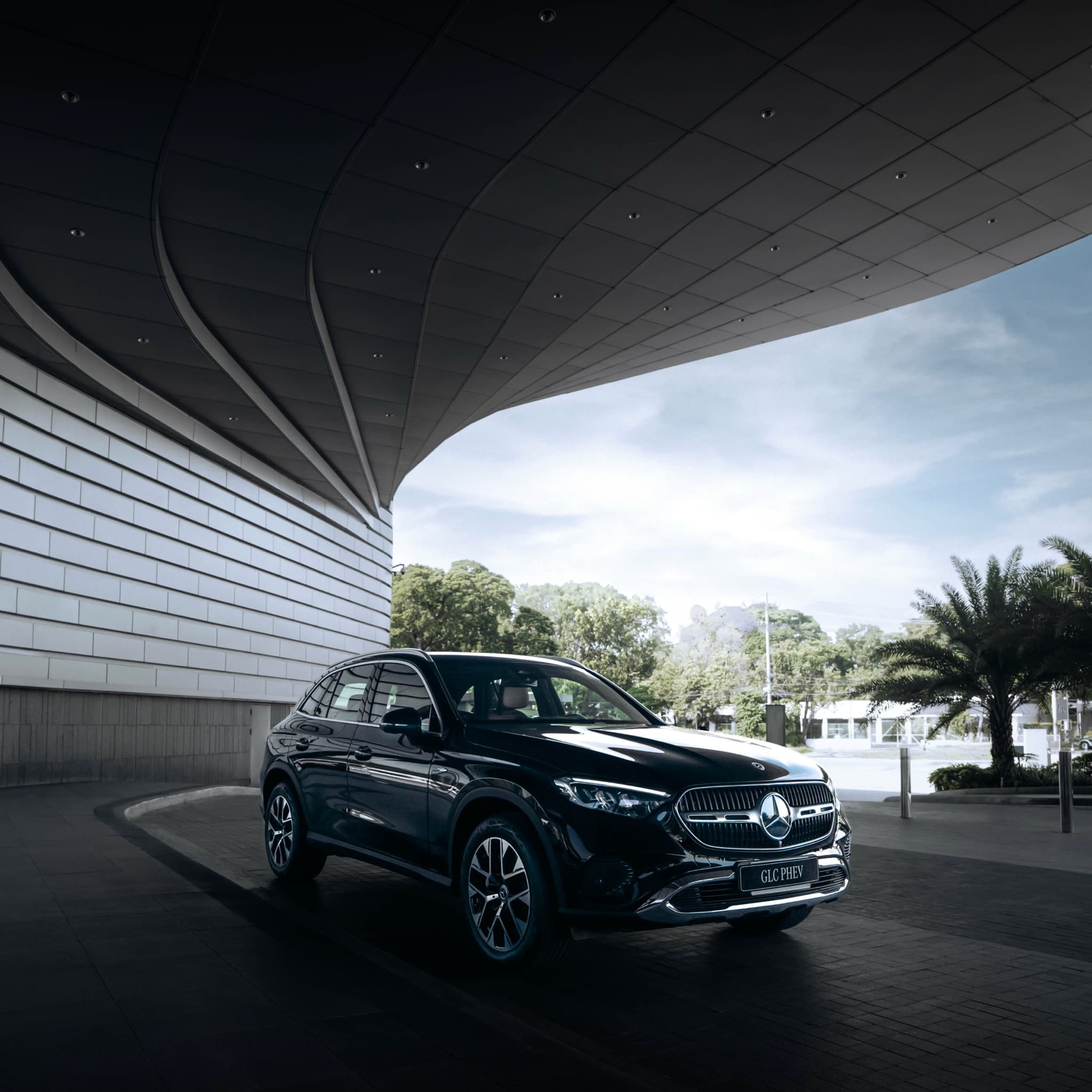 Mercedes-Benz GLC PHEV beneath the curved roof, photographed by Vibetribe