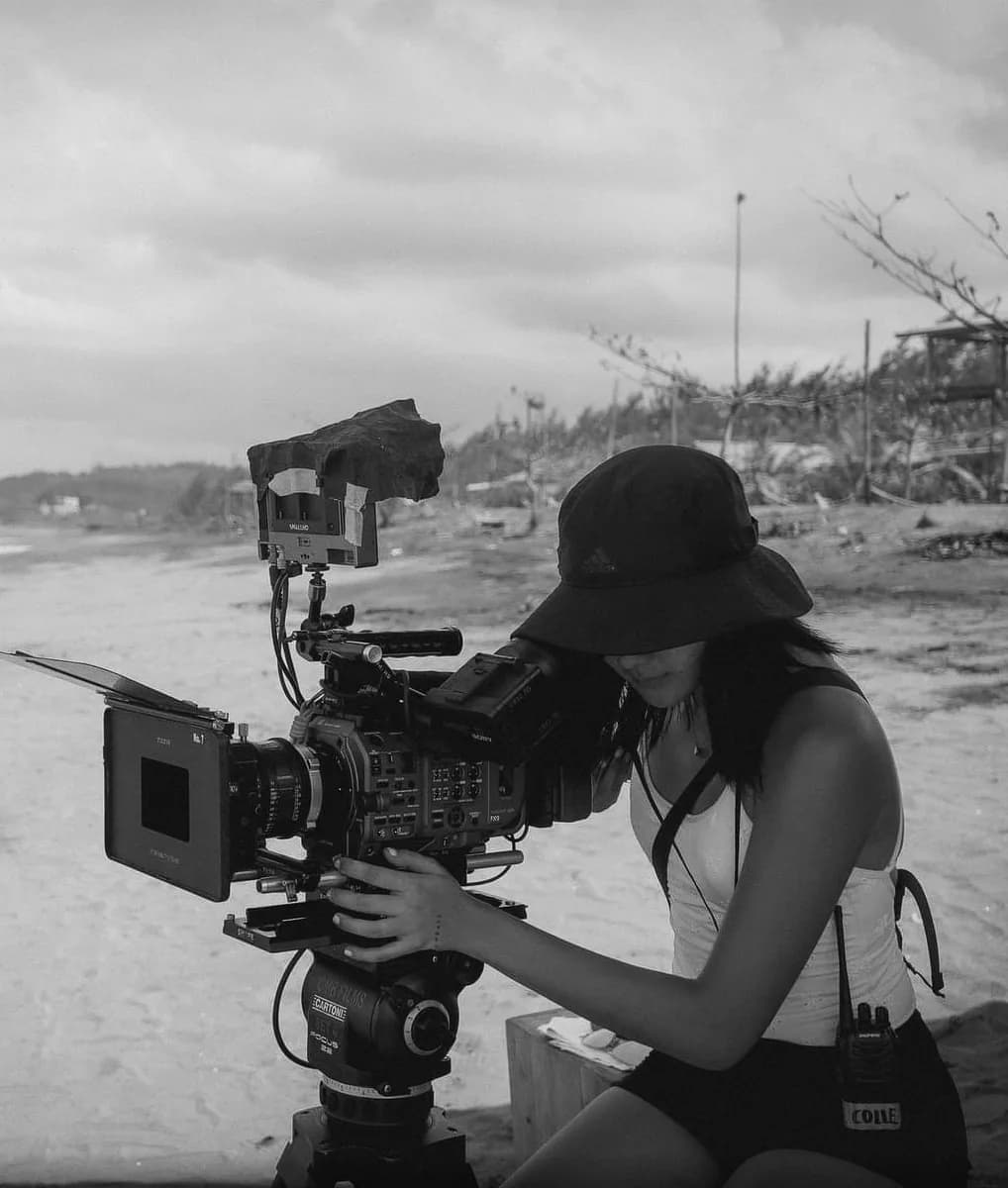 Nicolle Matutina operating a cinema camera on location